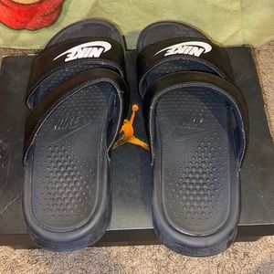 Nike two strap slippers.